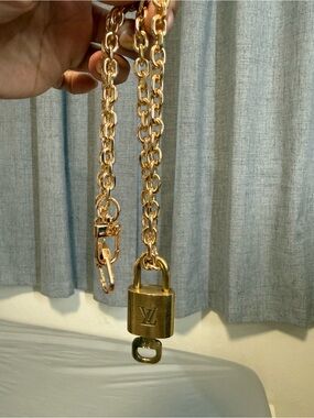 Louis Vuitton Gold-Tone lock and key with unbranded chain